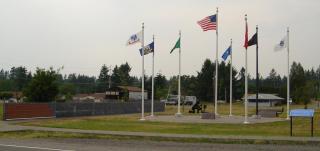 Veterans Memorial Park, flags flying next to memorial wall